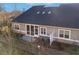 Aerial view of back exterior features a private patio and manicured landscaping at 334 Cherokee Station Cir, Woodstock, GA 30188