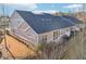 Aerial view of back exterior features a private patio and manicured landscaping at 334 Cherokee Station Cir, Woodstock, GA 30188