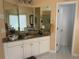 Bathroom with double mirror, granite topped vanity, soaking tub, and walk-in shower at 3381 Walkers Ridge Rd, Dacula, GA 30019