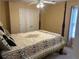 Bedroom featuring four poster bed, ceiling fan, and light-filled window with curtains at 3381 Walkers Ridge Rd, Dacula, GA 30019