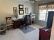 Carpeted home office bedroom with a desk and a ceiling fan at 3381 Walkers Ridge Rd, Dacula, GA 30019