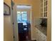 View of the dining area and wine bar area with cabinets for glassware at 3381 Walkers Ridge Rd, Dacula, GA 30019
