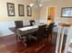 Formal dining room features a large dark wood table and a view to the butler's pantry at 3381 Walkers Ridge Rd, Dacula, GA 30019