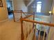 Second floor hallway with natural lighting, hardwood railings, and stairway access to first floor at 3381 Walkers Ridge Rd, Dacula, GA 30019