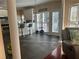 Open-concept kitchen with counter seating, stainless steel appliances, and lots of natural light at 3381 Walkers Ridge Rd, Dacula, GA 30019