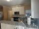 Modern kitchen with granite countertops, stainless steel appliances, and ample counter space at 3381 Walkers Ridge Rd, Dacula, GA 30019