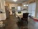 Eat-in kitchen area featuring white cabinets, stainless appliances, and stone tile flooring at 3381 Walkers Ridge Rd, Dacula, GA 30019