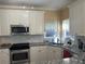 Stylish kitchen with granite counters, stainless steel appliances, and modern backsplash at 3381 Walkers Ridge Rd, Dacula, GA 30019