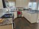 Updated kitchen with granite countertops, stainless steel appliances, and white cabinets at 3381 Walkers Ridge Rd, Dacula, GA 30019