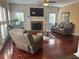 Inviting living room with hardwood floors, a fireplace, and comfortable seating at 3381 Walkers Ridge Rd, Dacula, GA 30019