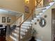 Grand foyer with hardwood staircase, chandelier, and natural light at 3381 Walkers Ridge Rd, Dacula, GA 30019