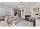 Cozy living room featuring a marble fireplace, decorative shelving, and hardwood floors at 4233 Hardy Ave, Smyrna, GA 30082