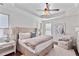 Main bedroom with tray ceiling, upholstered headboard, and an inviting sitting area at 4233 Hardy Ave, Smyrna, GA 30082