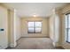 Bright bedroom with neutral walls, carpet, and natural light from a window with blinds at 6498 Stonelake Sw Pl, Atlanta, GA 30331