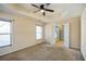 Bright bedroom featuring a ceiling fan and doorway to the on-suite bathroom at 6498 Stonelake Sw Pl, Atlanta, GA 30331