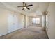 Bedroom featuring a ceiling fan, carpeted floor, and natural light from a window with blinds at 6498 Stonelake Sw Pl, Atlanta, GA 30331
