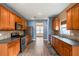 Spacious eat-in kitchen with stainless steel appliances and hardwood floors at 6498 Stonelake Sw Pl, Atlanta, GA 30331