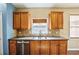 Bright kitchen features a stainless steel dishwasher and a window over the sink at 6498 Stonelake Sw Pl, Atlanta, GA 30331