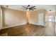 Open living room features a ceiling fan, hardwood floors, and neutral walls at 6498 Stonelake Sw Pl, Atlanta, GA 30331