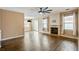 Large living room with hardwood floors, ceiling fan and access to backyard at 6498 Stonelake Sw Pl, Atlanta, GA 30331