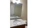 Granite countertop sink with mirror in a well lit bathroom at 6950 Oakhill Se Cir, Austell, GA 30168