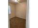 A cozy carpeted bedroom with natural light from a window with blinds at 6950 Oakhill Se Cir, Austell, GA 30168