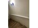 Interior stairwell with carpeted stairs and a white handrail provides safe access between floors at 6950 Oakhill Se Cir, Austell, GA 30168
