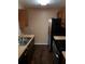 A kitchen featuring stainless steel appliances and dark wood cabinets at 2303 Pine Tree Trl, Atlanta, GA 30349