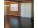 Living room with dark hardwood floors and a large window at 2303 Pine Tree Trl, Atlanta, GA 30349