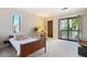 Sunlit bedroom showcasing a sliding door with access to the yard and a nice window for natural light at 3897 Allsborough Dr, Tucker, GA 30084