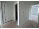 A hallway featuring white doors and walls, ready for personalization and decor at 691 Calvet Way, Cumming, GA 30041