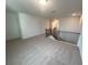 Upstairs carpeted loft space featuring gray railing with views to the staircase at 691 Calvet Way, Cumming, GA 30041