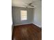 Bright bedroom with hardwood flooring and natural light from the window at 1686 Valencia Rd, Decatur, GA 30032