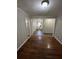 View of the dining room leading into the kitchen, featuring wood floors at 1686 Valencia Rd, Decatur, GA 30032