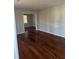 Open living room featuring hardwood floors and ample natural light at 1686 Valencia Rd, Decatur, GA 30032