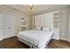 Bright bedroom features a large bed, hardwood floors, and white built-in cabinets at 850 Piedmont Ave # 2102, Atlanta, GA 30308