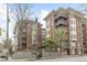 Exterior view of brick condominium buildings with multiple floors and balconies at 850 Piedmont Ave # 2102, Atlanta, GA 30308