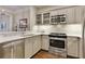 Well-lit kitchen with stainless steel appliances and light countertops at 850 Piedmont Ave # 2102, Atlanta, GA 30308