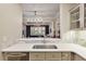 View of the living room from the kitchen through the quartz countertop pass-through at 850 Piedmont Ave # 2102, Atlanta, GA 30308