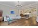 Open-concept living and dining area with hardwood floors, modern lighting, and comfortable seating at 850 Piedmont Ave # 2102, Atlanta, GA 30308