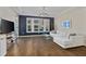 Spacious living room with hardwood floors, a white sofa, and large windows offering ample natural light at 850 Piedmont Ave # 2102, Atlanta, GA 30308