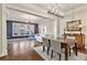 Spacious dining room connected to a brightly lit living area with hardwood floors at 850 Piedmont Ave # 2102, Atlanta, GA 30308