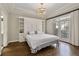 Bright main bedroom with hardwood floors, built-in storage, and access to a private balcony at 850 Piedmont Ave # 2102, Atlanta, GA 30308
