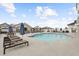 Resort-style pool with lounge chairs, umbrellas, and pergola offers a relaxing outdoor space at 850 Piedmont Ave # 2102, Atlanta, GA 30308