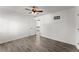 Neutral bedroom offers wood floors, ceiling fan and door at 1410 Barnsley Walk, Snellville, GA 30078