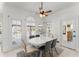 Bright breakfast nook with a white table and a view of the outdoor pool at 1410 Barnsley Walk, Snellville, GA 30078