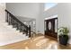 Bright foyer with hardwood floors and a staircase at 1410 Barnsley Walk, Snellville, GA 30078