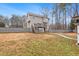 Fenced backyard with a wooden deck and plenty of space for recreation and relaxation at 194 Preston Nw Pl, Dallas, GA 30157