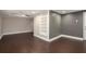 Finished basement with wood floors and a gray accent wall is spacious at 194 Preston Nw Pl, Dallas, GA 30157