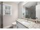 Bathroom featuring granite countertop, neutral paint, white cabinets, and a large mirror at 194 Preston Nw Pl, Dallas, GA 30157